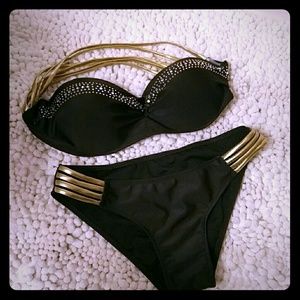 Black and gold strapless bikini with beaded accent