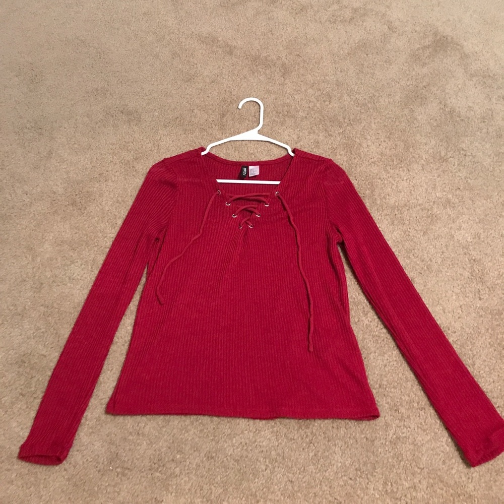 A long sleeve maroon top.