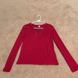 A long sleeve maroon top.