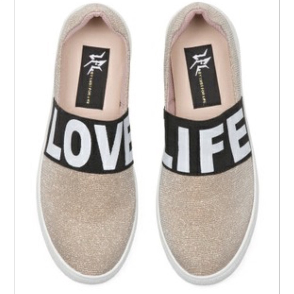 lust for life slip on gold blk n white sneakers