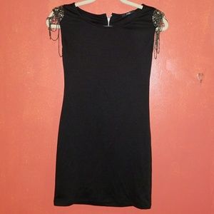 black dress with shoulder jewel details