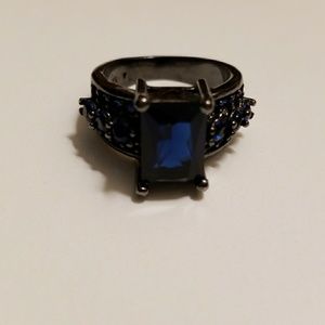 Blue Stones in Black Metal Ring Size 7
