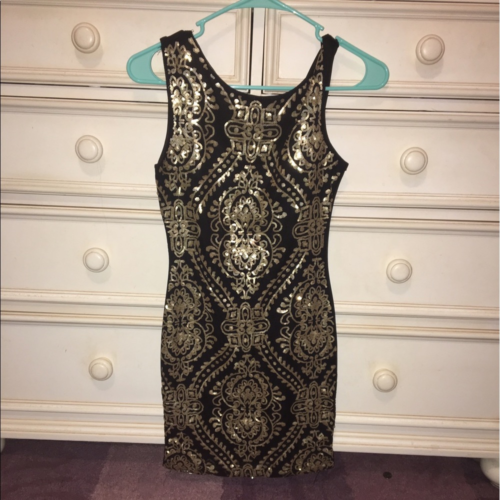 Black and gold sequence dress