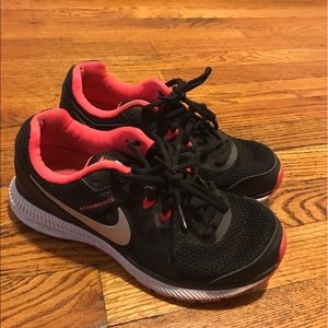 Pink and black nike sneakers