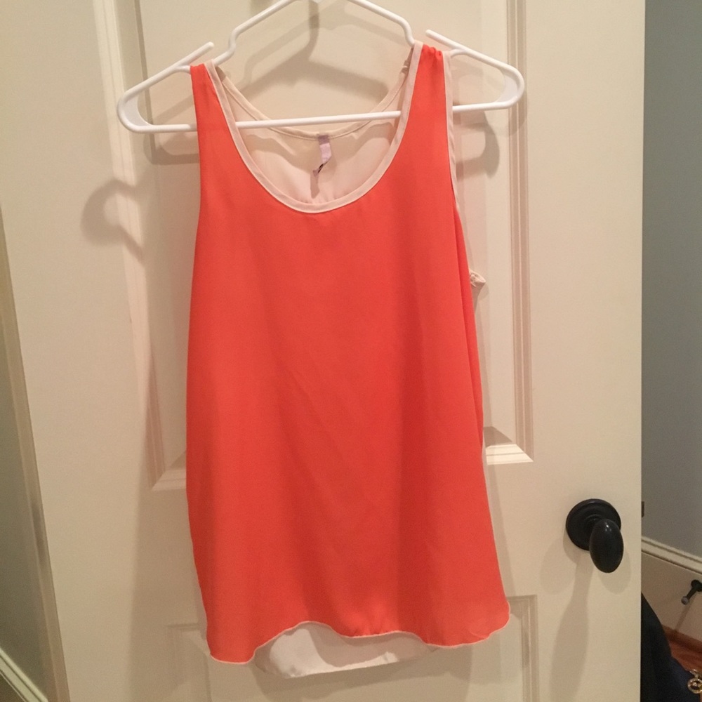 Orange and white sleeveless top