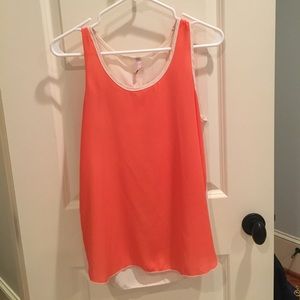 Orange and white sleeveless top