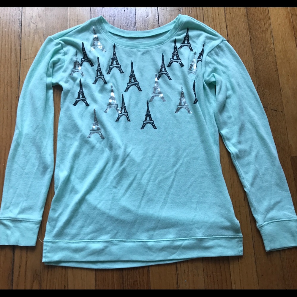 Mint green sweater with an Eiffel Tower design