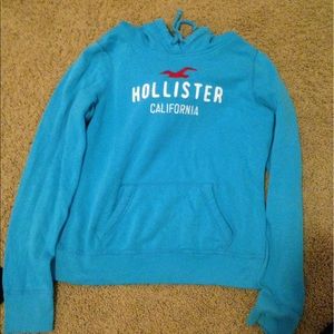 A blue Hollister pullover jacket