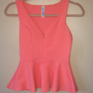 Coral v-neck peplum top.