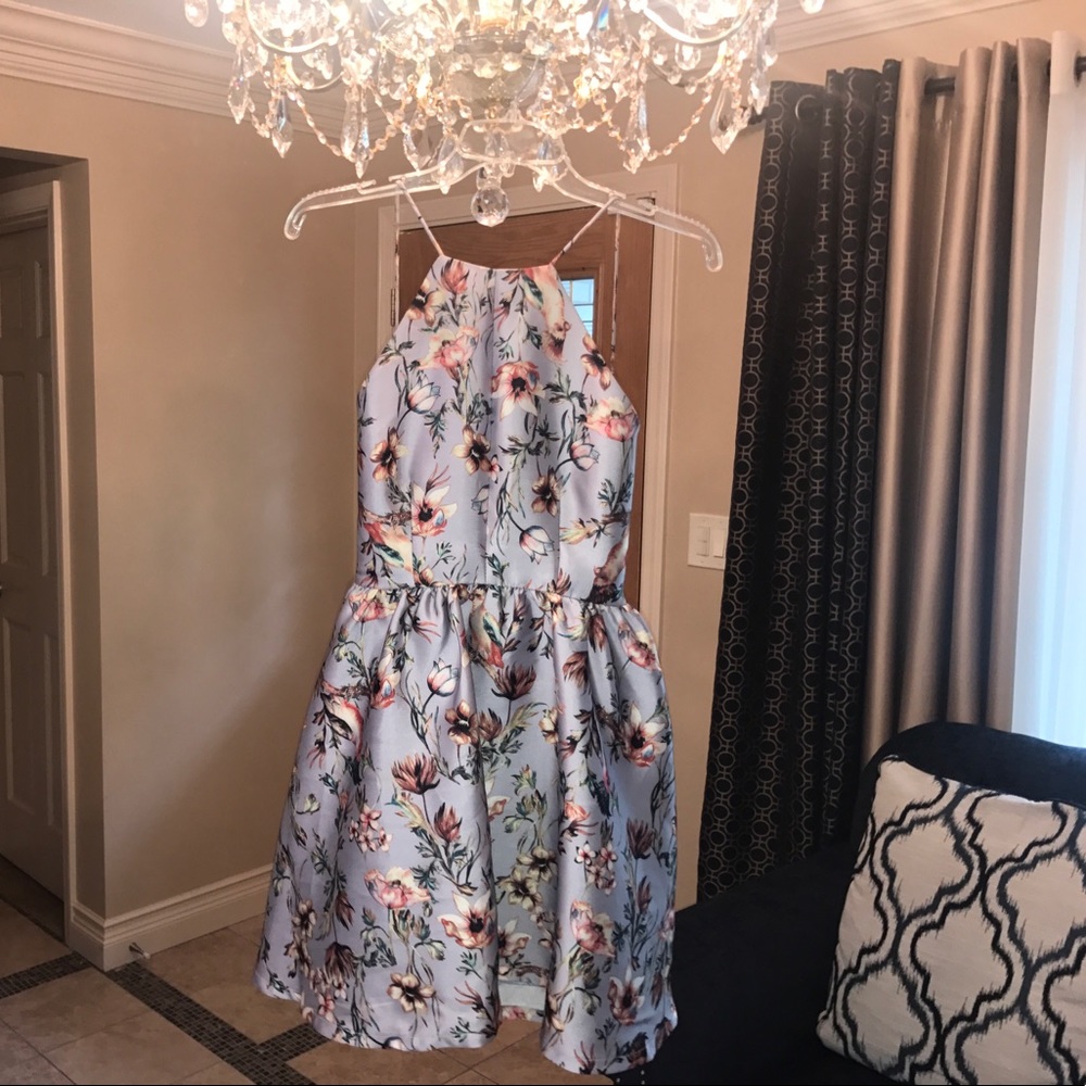 A periwinkle mini open back halter dress