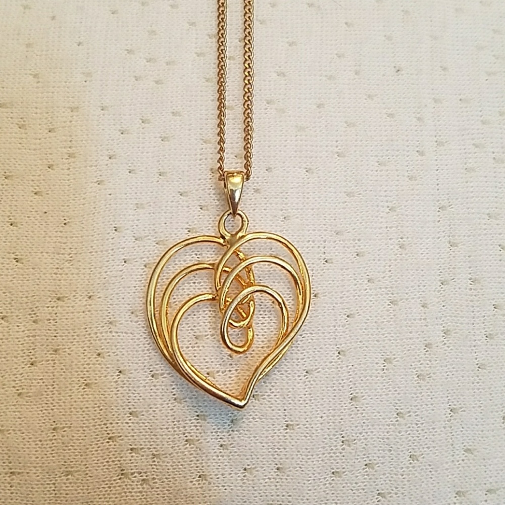 Gold wire three hearts interlinked