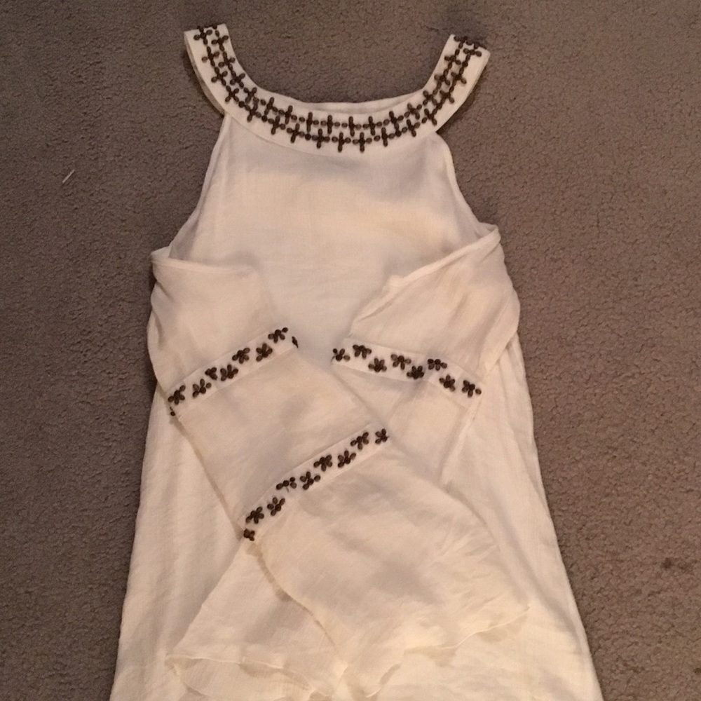Gorgeous cold shoulder dress with wooden beads.