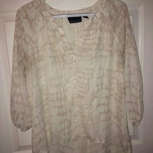 A loose long sleeved blouse