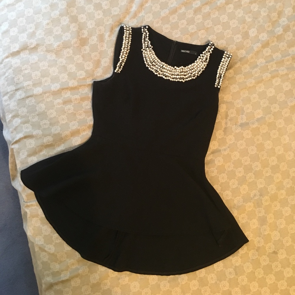 Embellished black peplum top
