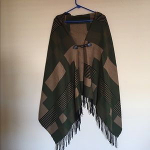 Hooded poncho with hook in front