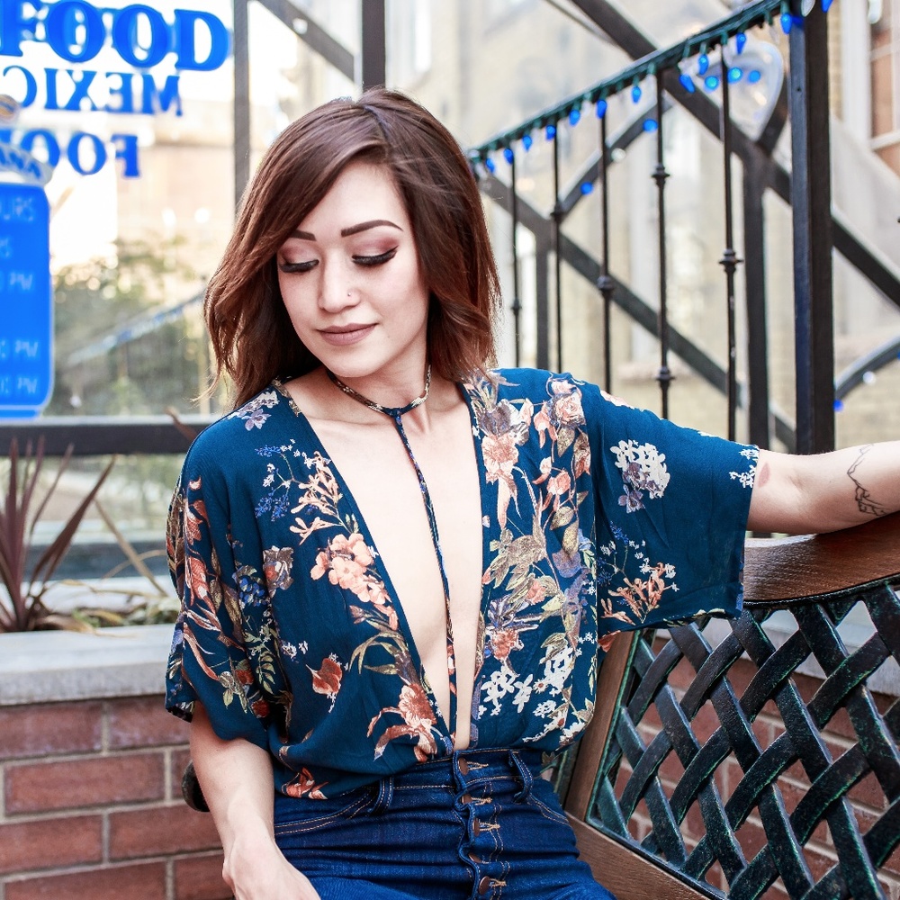 Navy blue floral body suit.