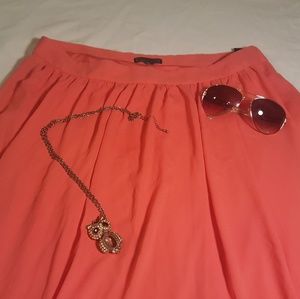 Maxi skirt, sunglasses, and owl necklace.