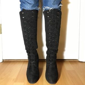 Knee high black faux suede lace up heeled boots