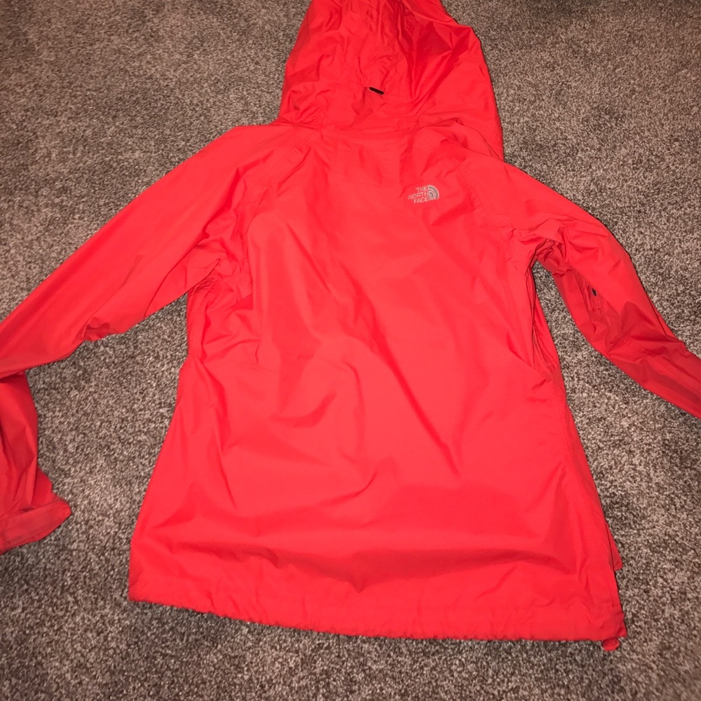 Coral and navy north face rain jacket