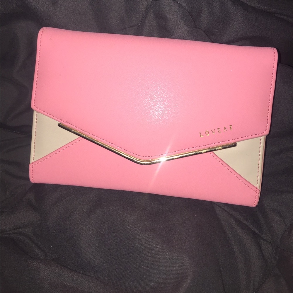 Pink and cream colored clutch