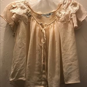 Cream colored lace top. A little short.
