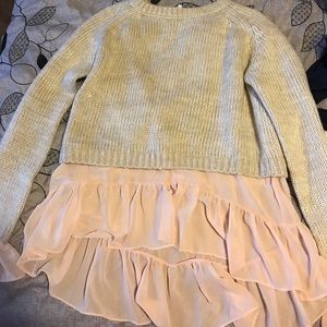 Chunky sweater with ruffle underlay.