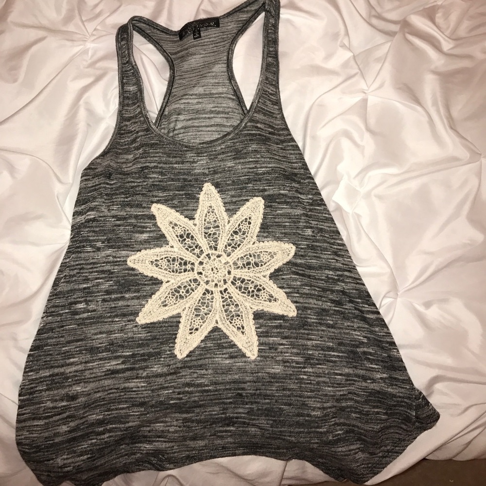 Tank top with a crochet flower