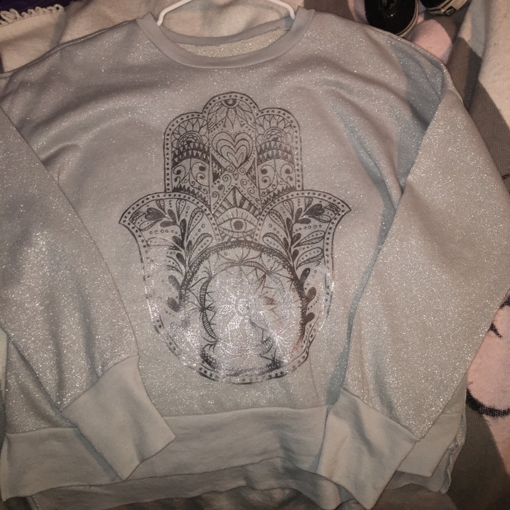 A gray sparkly sweatshirt