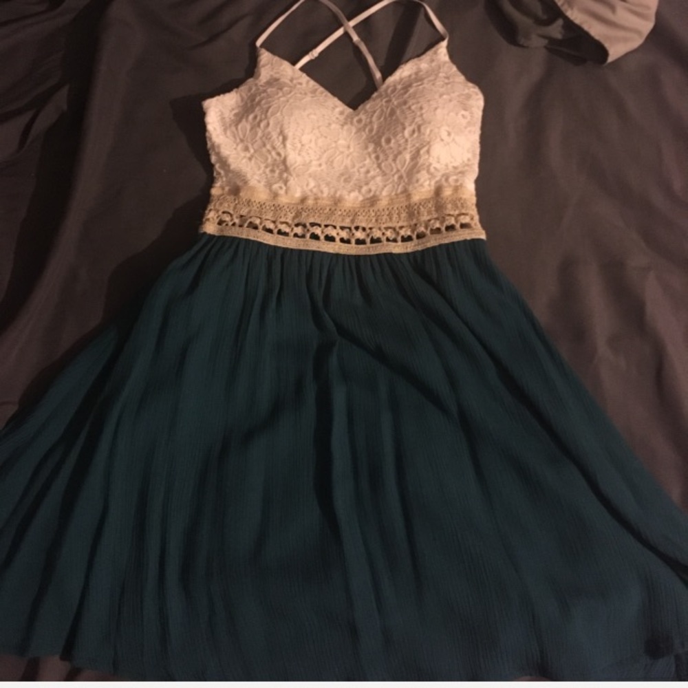 Lace top cross back padded mini dress