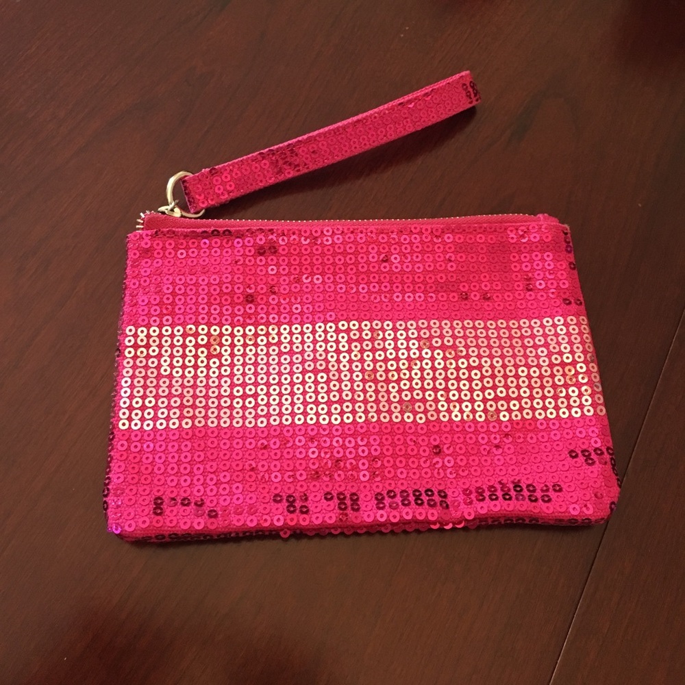 VS pink sequined wristlet clutch