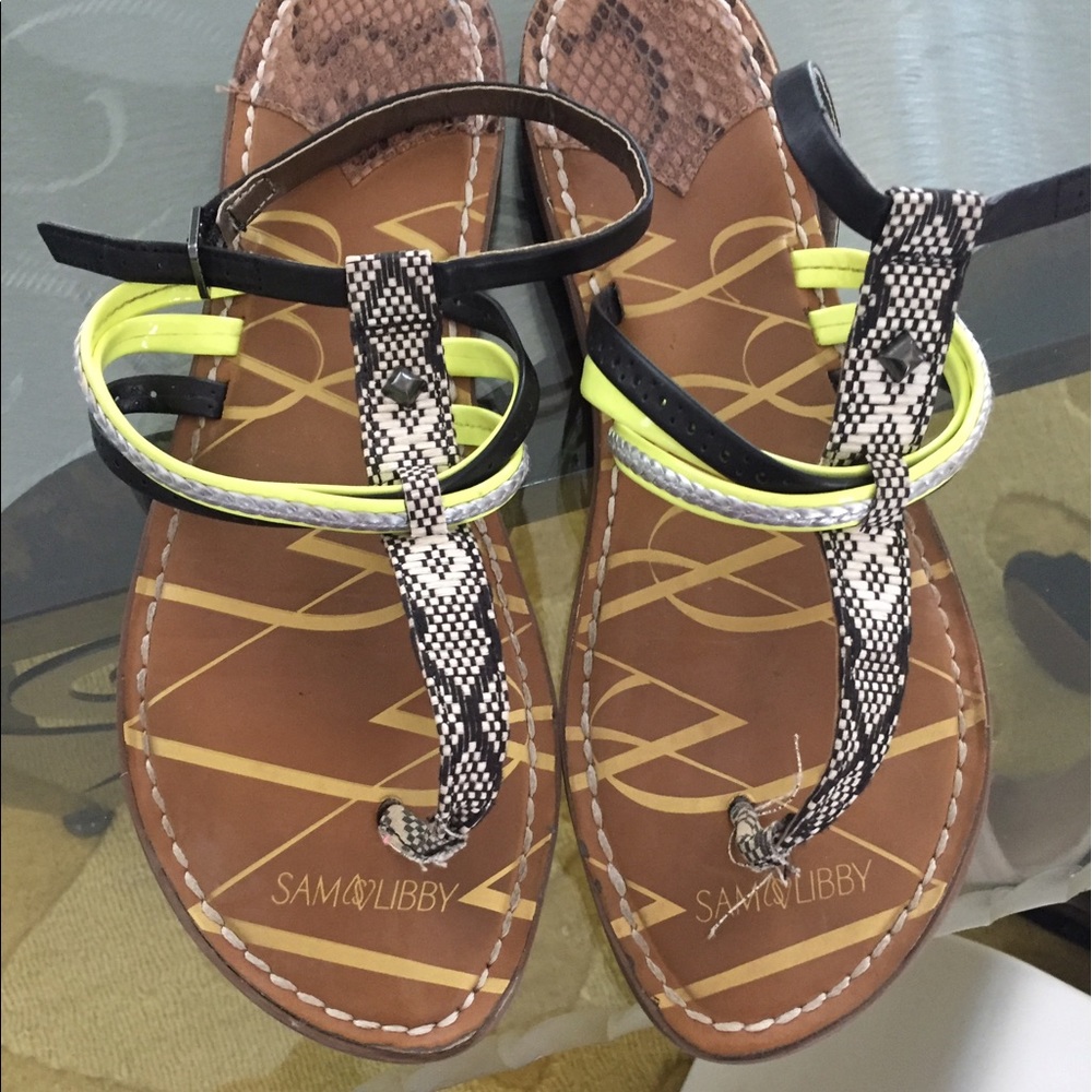 Flip flops with yellow and snake skin design