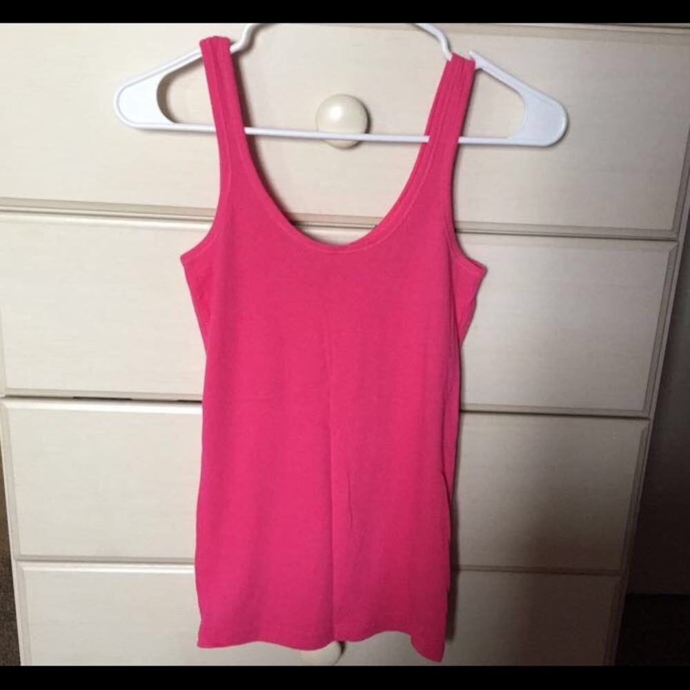 Either a pink or white tank