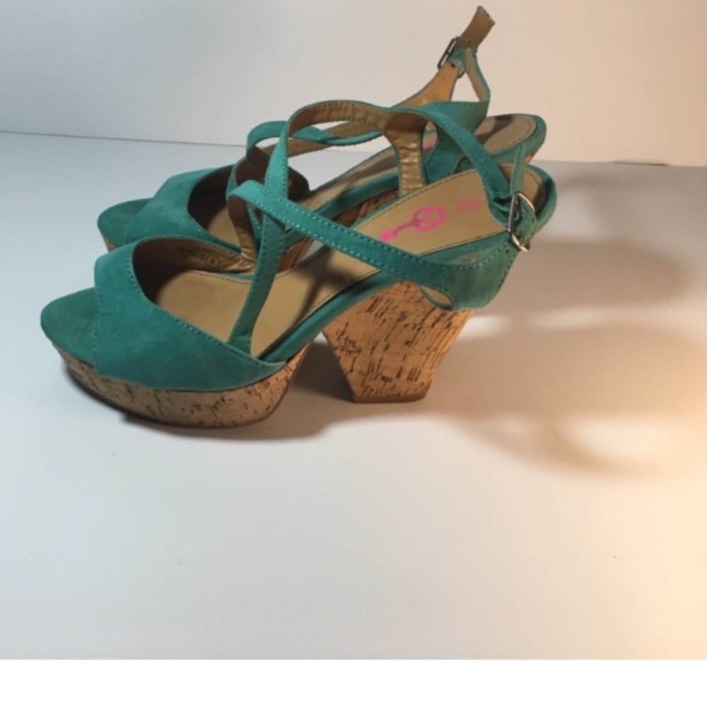 Size 8 turquoise semi wedge heels