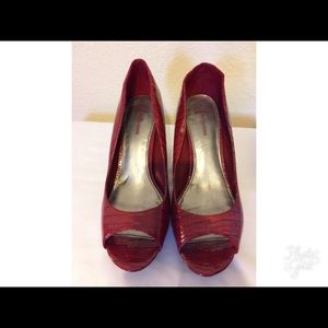Red Fergalicious snake skin pattern heels.