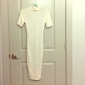 Ronny kobo pearl white dress hits below the knees