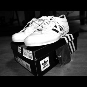 White Adidas Fullcourt Shoes.