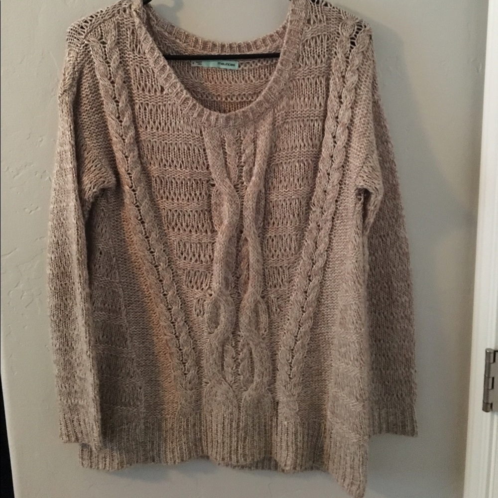 Tan Maurice's big sweater