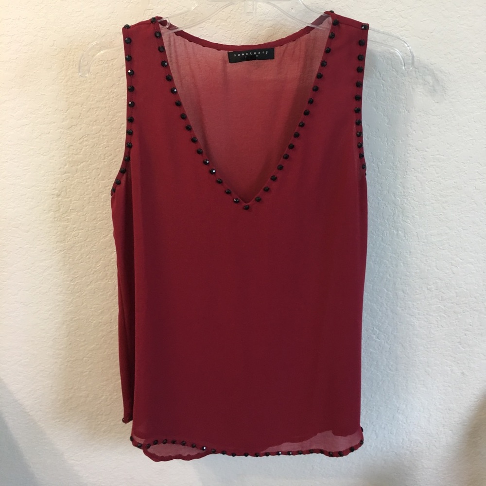 Red, sheer top with black beading detail.