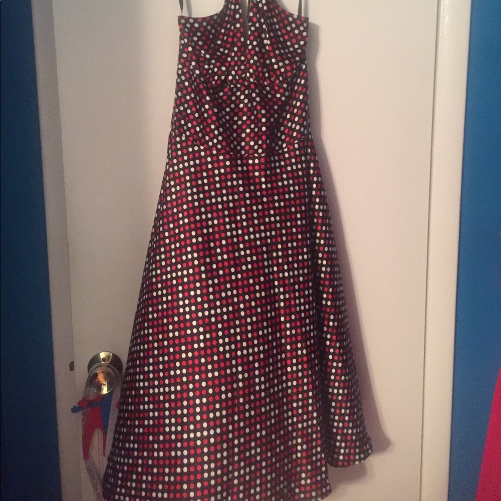 Black dress with red and white polka dots