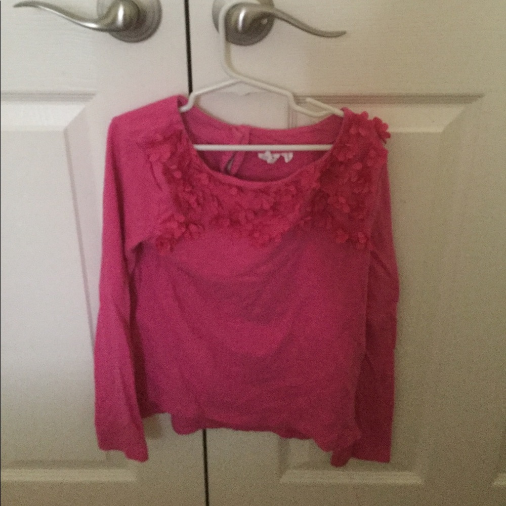 A pink T-shirt with flowers