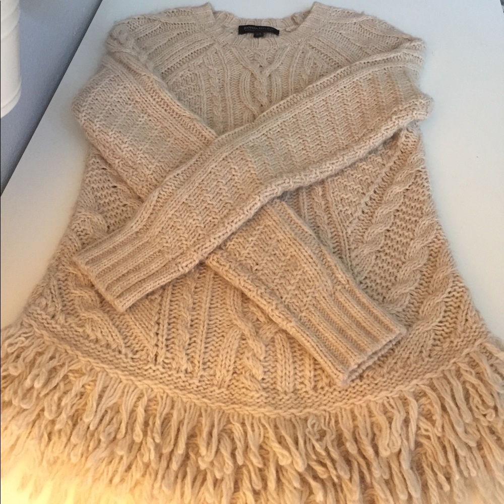 Cozy cable knit fringe sweater