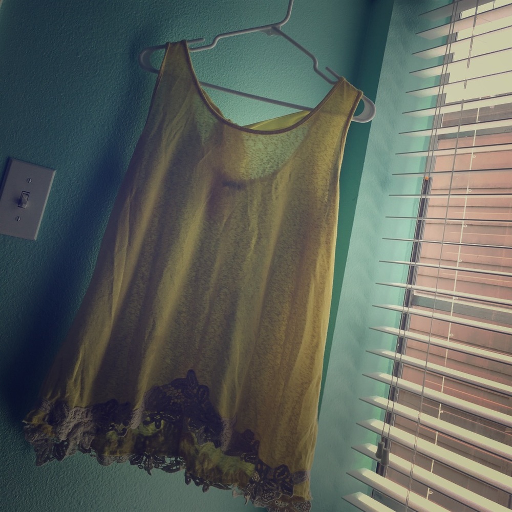 Yellow top with a bow in the back