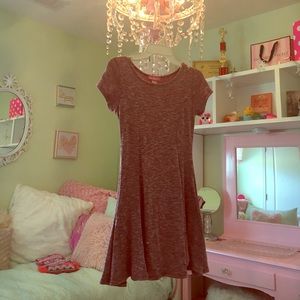 A fitted dress. A nude and white colors.