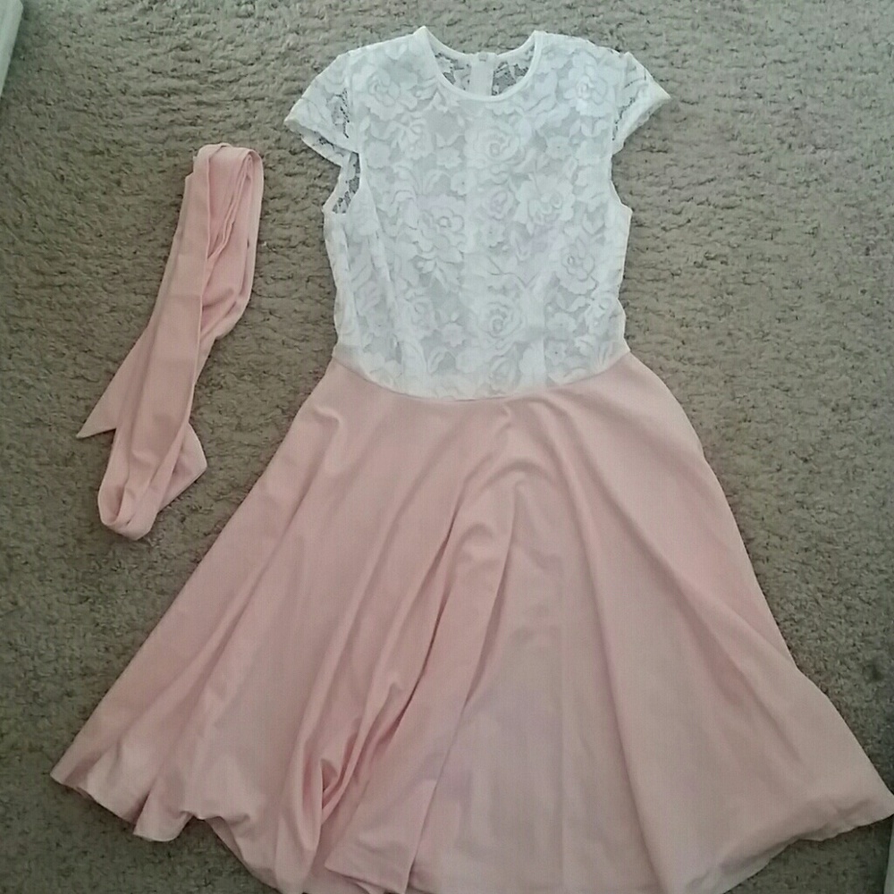 Pink and white lace dress with optional tie belt.