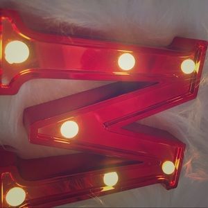 This is a light up red M