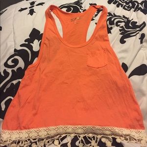 Orange tank top with fringe at bottom