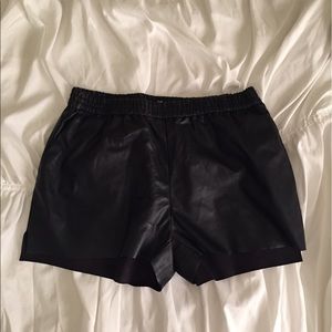Black faux leather shorts