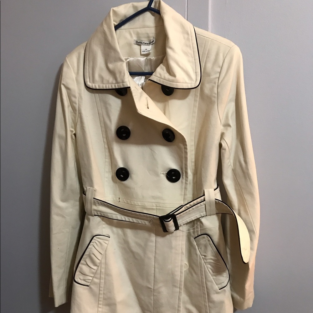 A cream colored dress coat