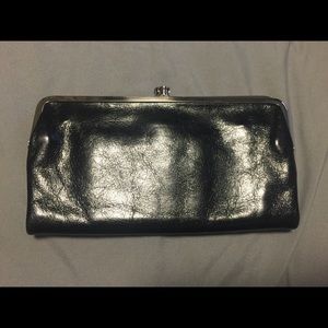 Medium sized black Hobo clutch wallet.