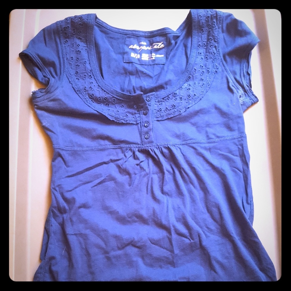 Blue shirt with cute detailing around neck line